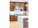 Gourmet kitchen boasts a stainless steel range hood, custom cabinets, and a center island for culinary enthusiasts at 233 Conifer Way, Shelby, NC 28150