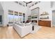 Bright living room featuring a fireplace, built-in shelving, large windows, and hardwood floors at 233 Conifer Way, Shelby, NC 28150