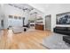Bright living room featuring a fireplace, built-in shelving, and hardwood floors at 233 Conifer Way, Shelby, NC 28150