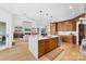 Open concept living area with modern kitchen island, fireplace, and seamless access to the living room at 233 Conifer Way, Shelby, NC 28150