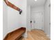 Practical mudroom with wooden bench, coat hooks, and storage space, perfect for organized entry and exit at 233 Conifer Way, Shelby, NC 28150