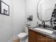 Stylish powder room showcases a modern vanity, sleek fixtures, and a minimalist design for a contemporary feel at 233 Conifer Way, Shelby, NC 28150