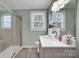 Bright bathroom featuring a vanity sink and mirror and a walk-in shower at 2420 Kannapolis Hwy, Concord, NC 28027