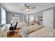 Cozy bedroom with two beds, a desk, and plenty of natural light at 2420 Kannapolis Hwy, Concord, NC 28027