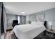 Bedroom featuring neutral color palette, updated flooring, and bright natural light at 2420 Kannapolis Hwy, Concord, NC 28027