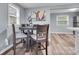 Dining area featuring modern flooring, neutral color palette, and bright natural light at 2420 Kannapolis Hwy, Concord, NC 28027