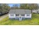 Charming single-story home featuring blue shutters, a covered front porch, and a well-maintained lawn at 2420 Kannapolis Hwy, Concord, NC 28027