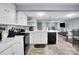 Spacious kitchen featuring modern appliances, updated cabinets, and easy access to the dining area at 2420 Kannapolis Hwy, Concord, NC 28027