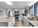 Modern kitchen showcasing stainless steel appliances, light gray cabinets, and granite countertops at 2420 Kannapolis Hwy, Concord, NC 28027