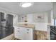 Spacious kitchen featuring stainless steel appliances, granite countertops, and an island at 2420 Kannapolis Hwy, Concord, NC 28027