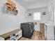 The laundry room is equipped with a modern washer, dryer and storage at 2420 Kannapolis Hwy, Concord, NC 28027