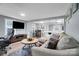 Open-concept living room flows into dining area, featuring modern furnishings and natural light at 2420 Kannapolis Hwy, Concord, NC 28027