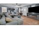 Inviting living room features hardwood floors, a ceiling fan, and a comfortable sectional sofa at 2420 Kannapolis Hwy, Concord, NC 28027