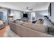 Inviting living room showcasing hardwood floors, a ceiling fan, and a comfortable sectional sofa at 2420 Kannapolis Hwy, Concord, NC 28027