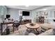 Open-concept living room featuring modern flooring and dining area with bright natural light at 2420 Kannapolis Hwy, Concord, NC 28027