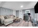Cozy living room featuring a comfortable sectional sofa and a workspace with a desk at 2420 Kannapolis Hwy, Concord, NC 28027