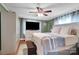 The main bedroom features a ceiling fan, flat screen TV, and a well lit space at 2420 Kannapolis Hwy, Concord, NC 28027
