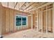 A framed bedroom with a large window, stud walls, and electrical wiring at 2508 Rock Dam Rd, Lincolnton, NC 28092