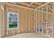 A framed bedroom with a window, stud walls, and electrical wiring at 2508 Rock Dam Rd, Lincolnton, NC 28092