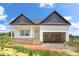 New construction home with white siding, brick foundation, and a two-car garage in a rural setting at 2508 Rock Dam Rd, Lincolnton, NC 28092