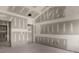 Bright and airy living room with unfinished walls, bare floors, and ample space for customization at 2508 Rock Dam Rd, Lincolnton, NC 28092