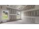Unfinished living room showcasing large windows, abundant sunlight, and a versatile design layout at 2508 Rock Dam Rd, Lincolnton, NC 28092