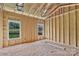 A framed living room area boasts natural light from two windows at 2508 Rock Dam Rd, Lincolnton, NC 28092