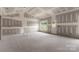 Inviting living room with unfinished walls, new windows, an exterior door, and room for personalization at 2508 Rock Dam Rd, Lincolnton, NC 28092