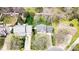 Aerial view showcasing the property, neighboring homes, and a well-maintained yard with mature trees and a white fence at 2510 Bricker Dr, Charlotte, NC 28273