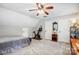 Bedroom with neutral walls features an exercise bike, shelving and an area for exercising at 2510 Bricker Dr, Charlotte, NC 28273