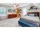 Bedroom features a wooden dresser, accent chair, decorative shelving, and a comfortable bed at 2510 Bricker Dr, Charlotte, NC 28273