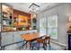 Elegant dining room with modern lighting, built-in cabinets, and large windows at 2510 Bricker Dr, Charlotte, NC 28273