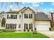 Charming two-story home featuring a well-manicured lawn, black shutters, and an attached two-car garage at 2510 Bricker Dr, Charlotte, NC 28273
