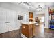 Kitchen island with storage and seating area, ideal for food preparation and socializing with an open concept at 2510 Bricker Dr, Charlotte, NC 28273