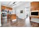 Bright kitchen boasts stainless appliances, central island, and opens to dining area with beautiful wood floors at 2510 Bricker Dr, Charlotte, NC 28273