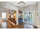 Bright living room with sliding doors to the screen porch and entertainment area with wooden decor and shelves at 2510 Bricker Dr, Charlotte, NC 28273