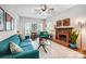 Comfortable living room featuring a fireplace, blue sofa, and ample natural light at 2510 Bricker Dr, Charlotte, NC 28273