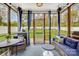 Relaxing screened-in porch with comfortable seating and views of the backyard at 2510 Bricker Dr, Charlotte, NC 28273