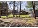 Backyard shot exhibiting a lush lawn, mature trees and exterior home construction at 2650 31St Street Ne Ct, Hickory, NC 28601
