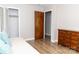 Bedroom featuring a bed, a dresser, a closet, and wood-look floor at 2650 31St Street Ne Ct, Hickory, NC 28601