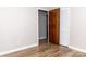 A bedroom with laminate flooring, neutral walls, closet, and doorway at 2650 31St Street Ne Ct, Hickory, NC 28601