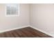 Bedroom with laminate flooring, neutral walls, and a window at 2650 31St Street Ne Ct, Hickory, NC 28601