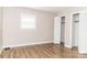 Bedroom featuring a closet, a bright window, and wood-look floor at 2650 31St Street Ne Ct, Hickory, NC 28601
