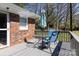 A deck featuring outdoor furniture including a round table and blue chairs at 2650 31St Street Ne Ct, Hickory, NC 28601