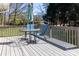 A deck featuring outdoor furniture including a round table and blue chairs at 2650 31St Street Ne Ct, Hickory, NC 28601