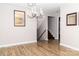 Well-lit dining room with hardwood floors and stairway at 2650 31St Street Ne Ct, Hickory, NC 28601