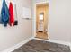 Inviting entryway featuring coat rack, whiteboard, and a glimpse into the stylishly updated bathroom at 2650 31St Street Ne Ct, Hickory, NC 28601