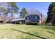 Charming front exterior featuring lush landscaping, a well manicured lawn and updated siding at 2650 31St Street Ne Ct, Hickory, NC 28601