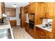 Traditional kitchen with wood cabinets, white countertops and stainless steel appliances at 2650 31St Street Ne Ct, Hickory, NC 28601