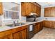 Traditional kitchen with wood cabinets, stainless steel sink and appliances at 2650 31St Street Ne Ct, Hickory, NC 28601